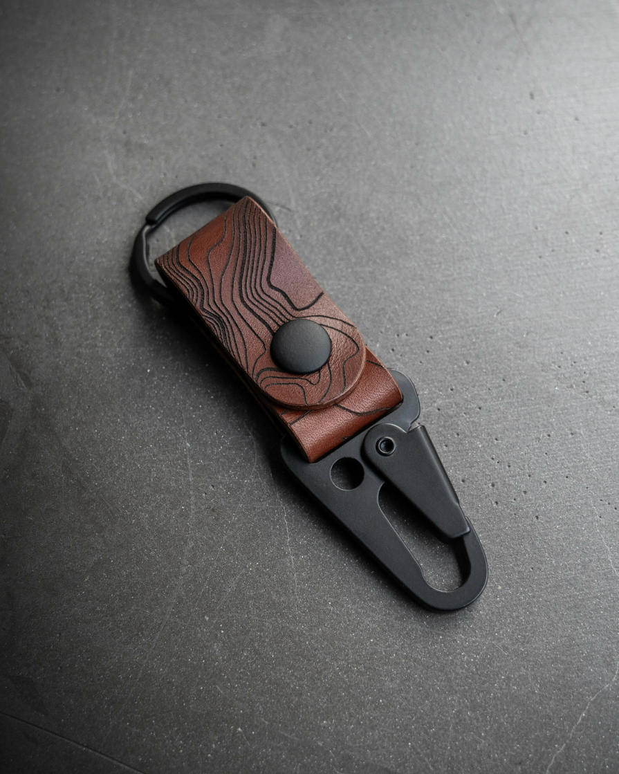 topographic engraved-keychain brown leather