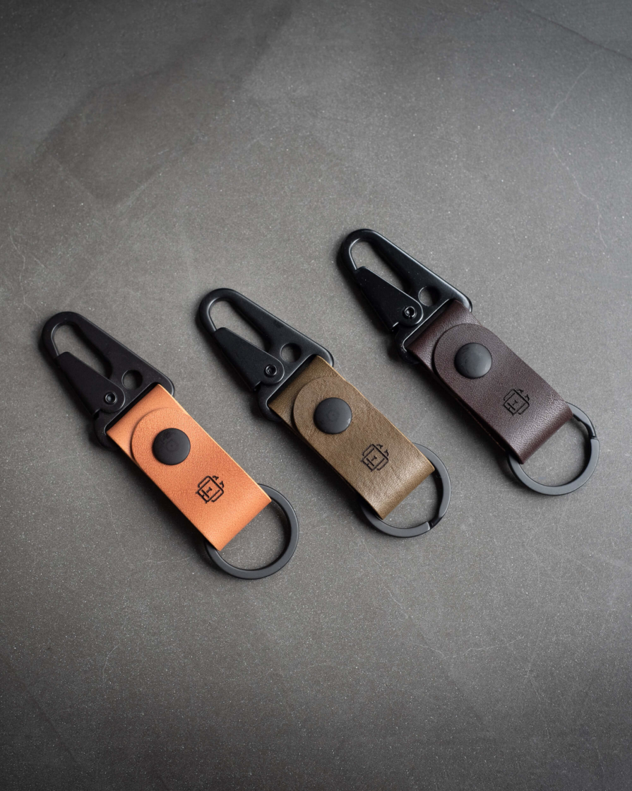 leather keychain in tan, olive and dark brown