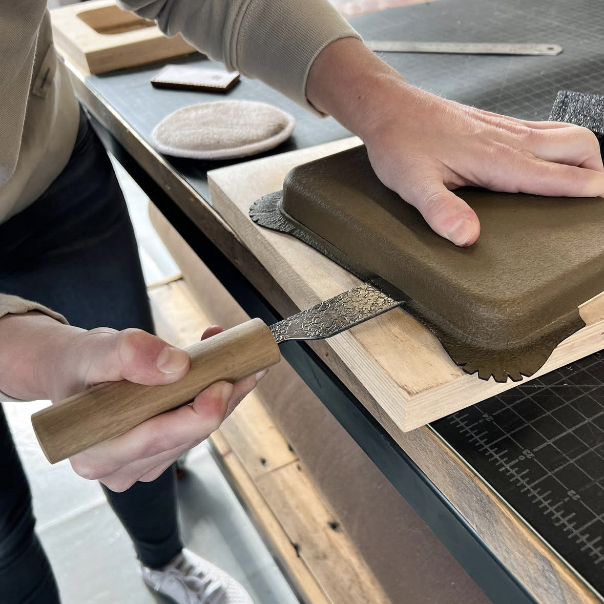 hand cutting molded leather valet trays
