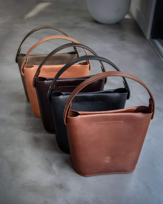 Leather bucket bag color options: brown, black, dark brown, tan and olive