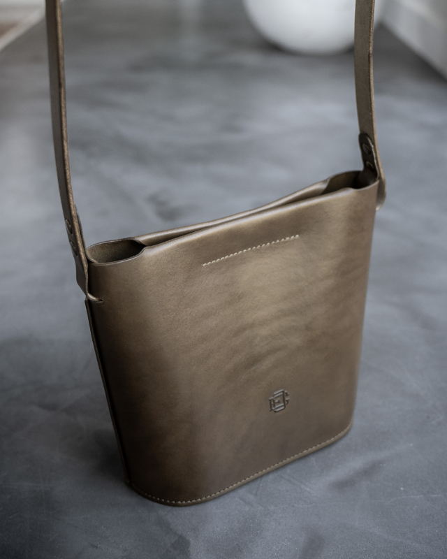 Olive leather bucket bag front
