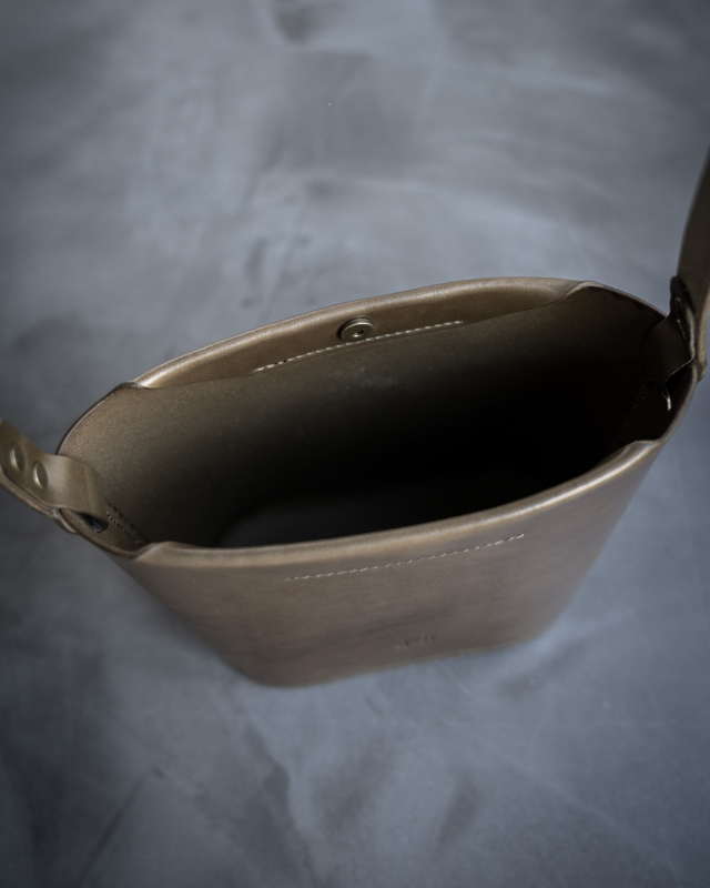 Olive leather bucket bag open top down view